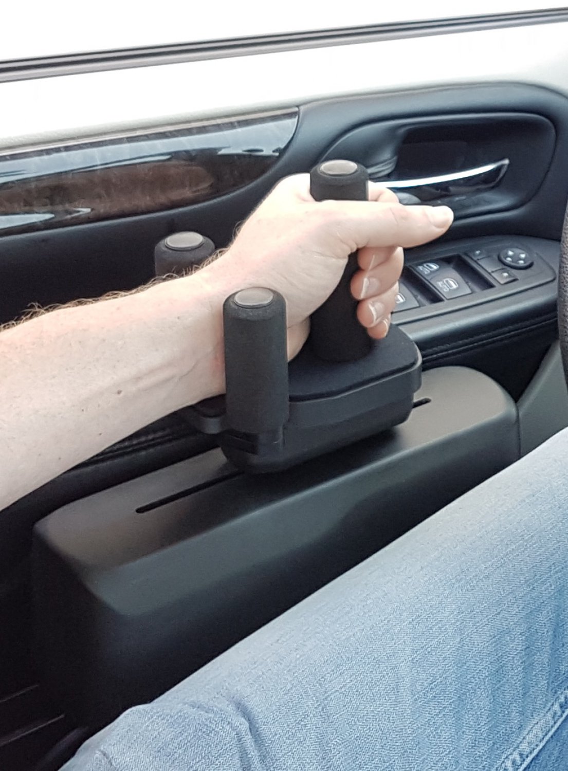 Bever gas and brake slider hand control fitted in a car