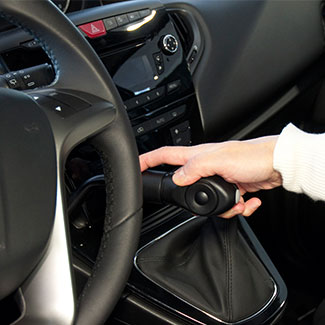Kivi push-down brake and slider hand control fitted beside the steering wheel