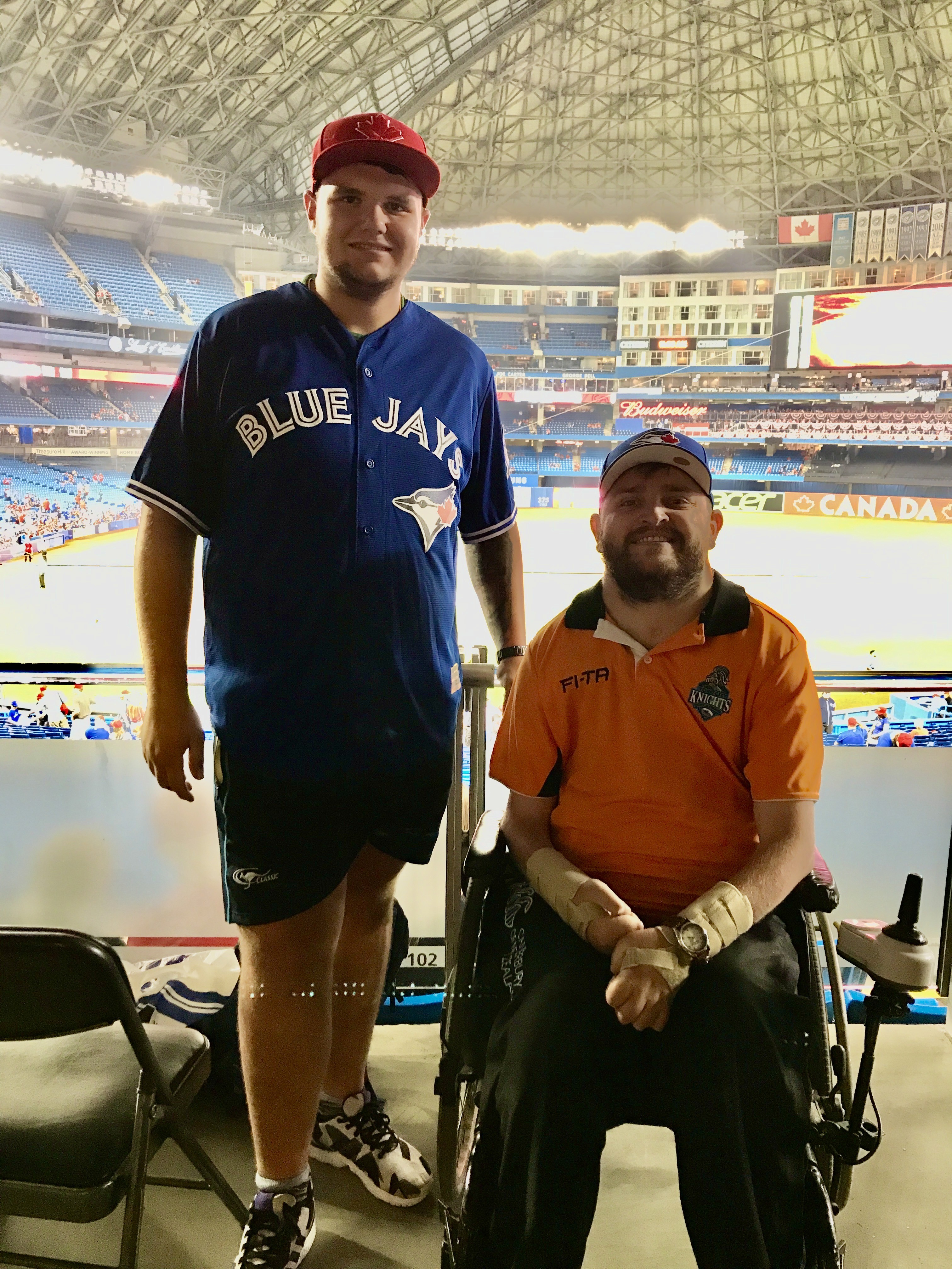 Gavin Wilson with a companion at a baseball game in Toronto