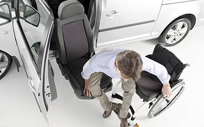 Overhead view of a wheelchair user transferring onto the Turny Evo seat