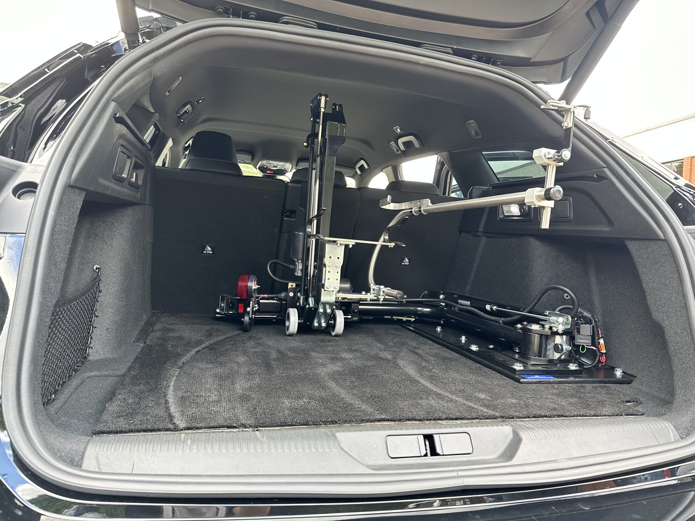 Abi Loader installed in a car boot, folded away and taking up little space