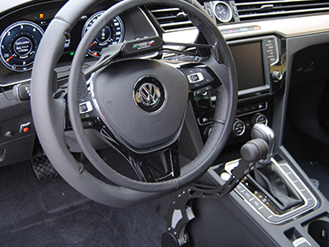 Handytech over-ring accelerator fitted to a steering wheel