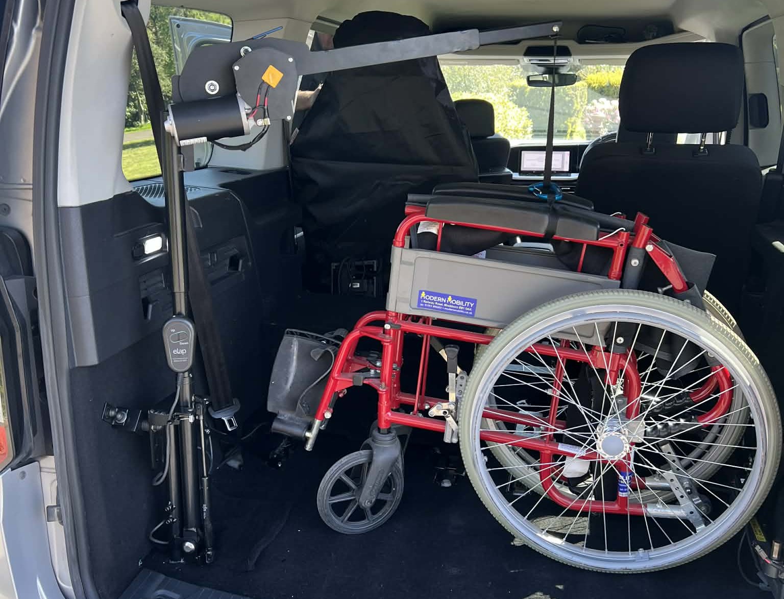 Elap E50 boot hoist lifting a wheelchair into a vehicle