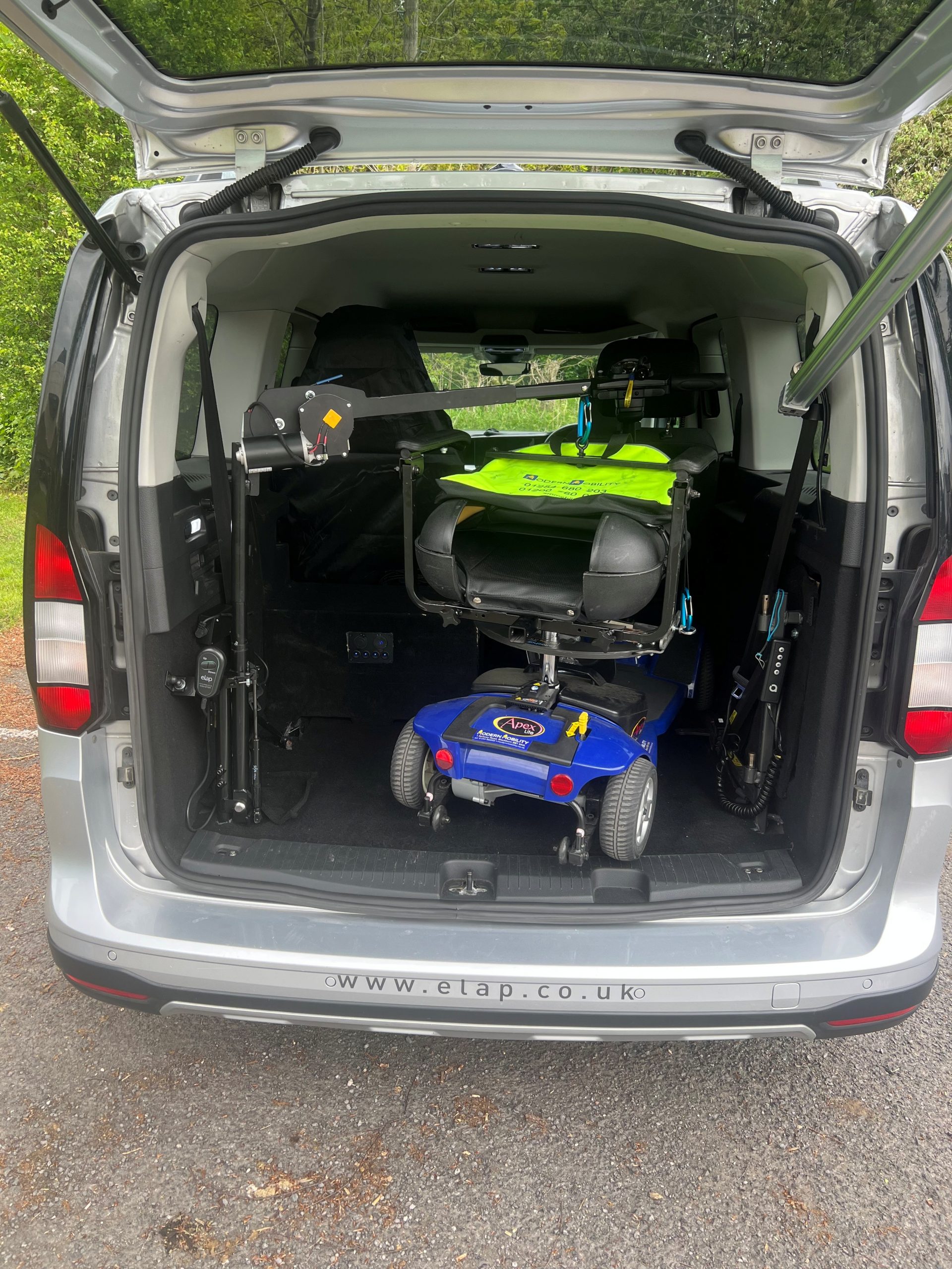 Elap E50 50kg boot hoist lifting a mobility scooter into a car boot