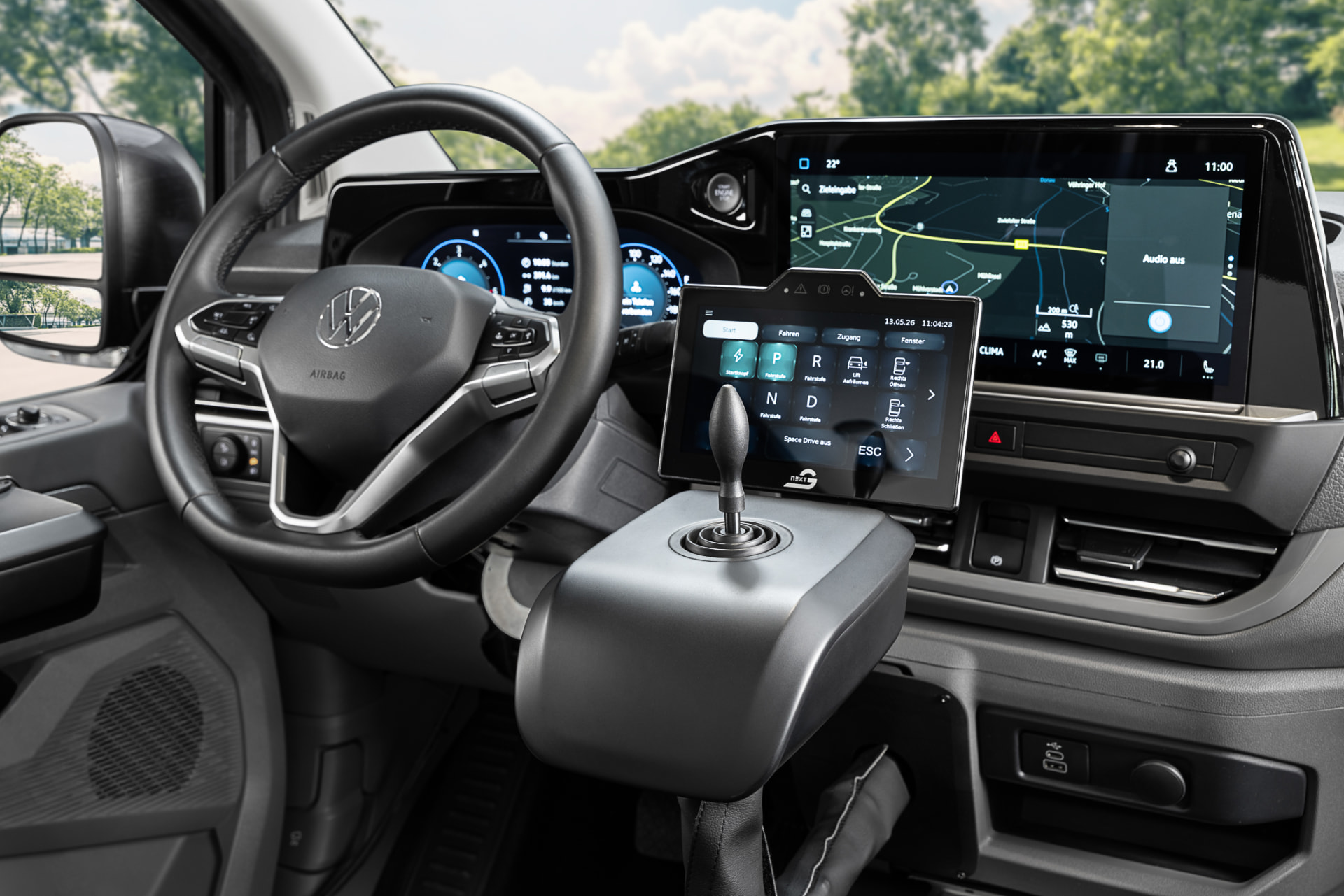Volkswagen Caravelle cockpit fitted with Paravan SpaceDrive electronic joystick driving controls