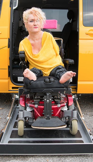 Alison boarding the Caravelle on the wheelchair ramp