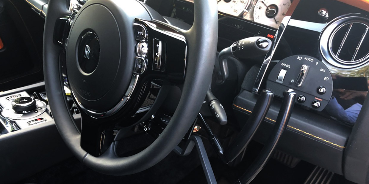 Feeny & Johnson twin-lever hand controls fitted beneath a Rolls-Royce steering wheel