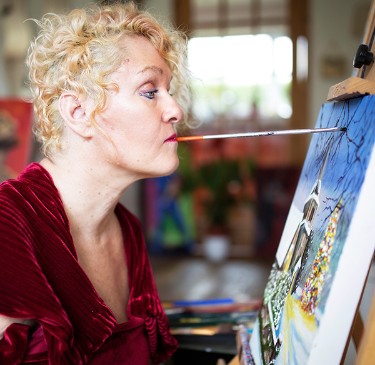Alison painting in her studio