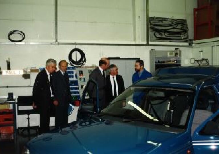 Royalty on tour of our old workshop and seeing cars in different stages of adaptions